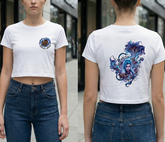 Person wearing a white t-shirt with a colorful design on the front and back, standing outdoors.