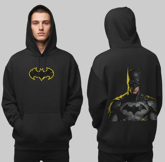 Black hoodie with Batman logo on front and character on back worn by a person, against a gray background